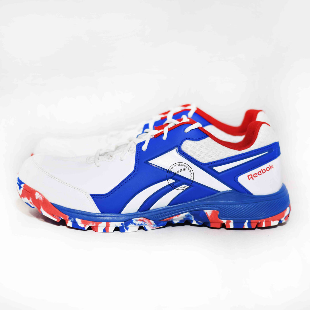 Reebok Brilliance Cricket Rubber Shoes White /Vector Red /Vector Blue Size @ Side View